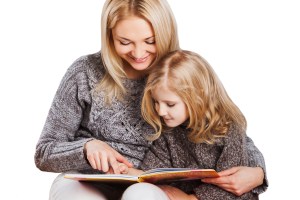 Mother reading with little daughter
